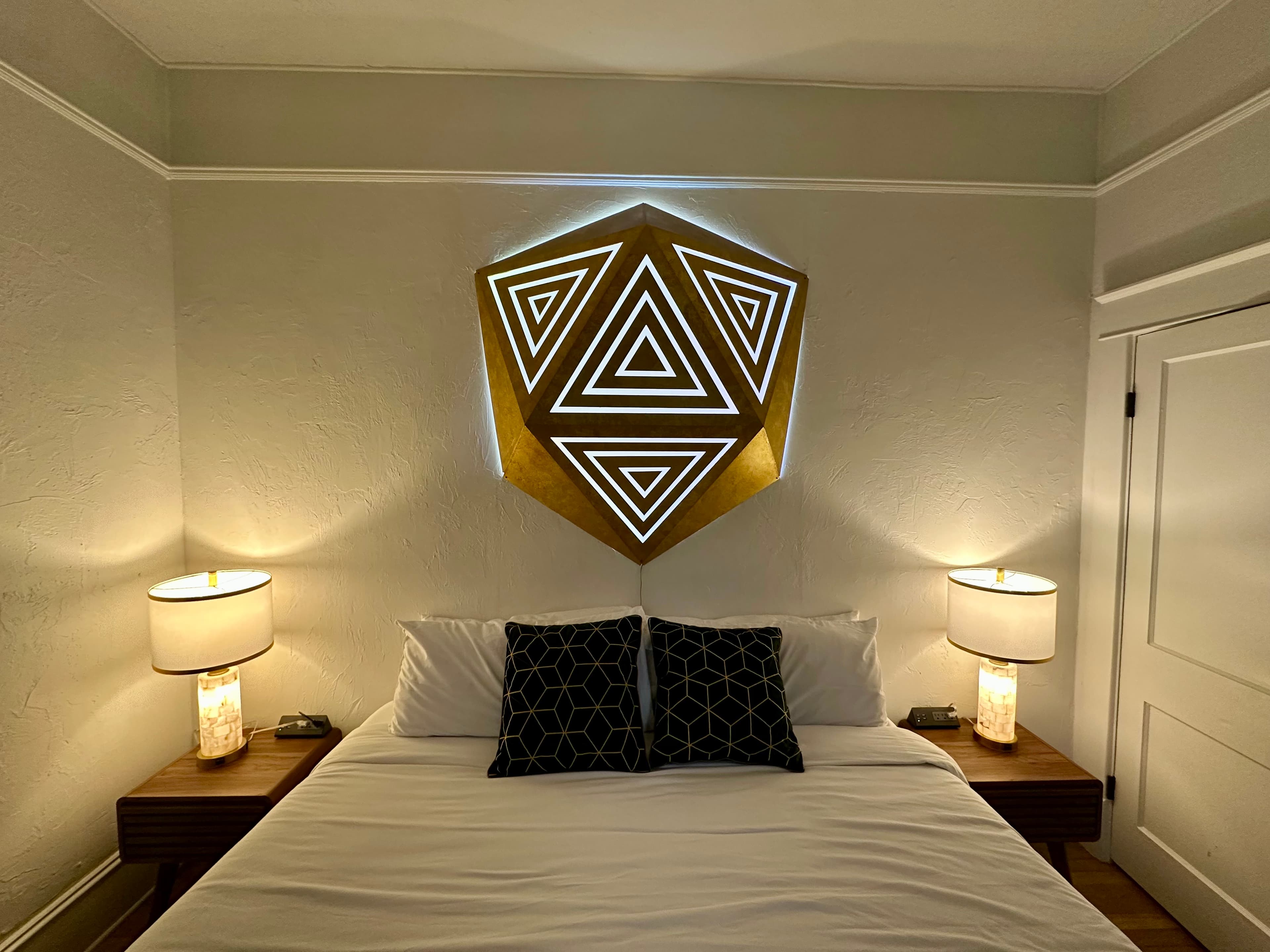 Parametric triangle headboard installation in a bedroom, Eclectic Electric art Gainesville FL
