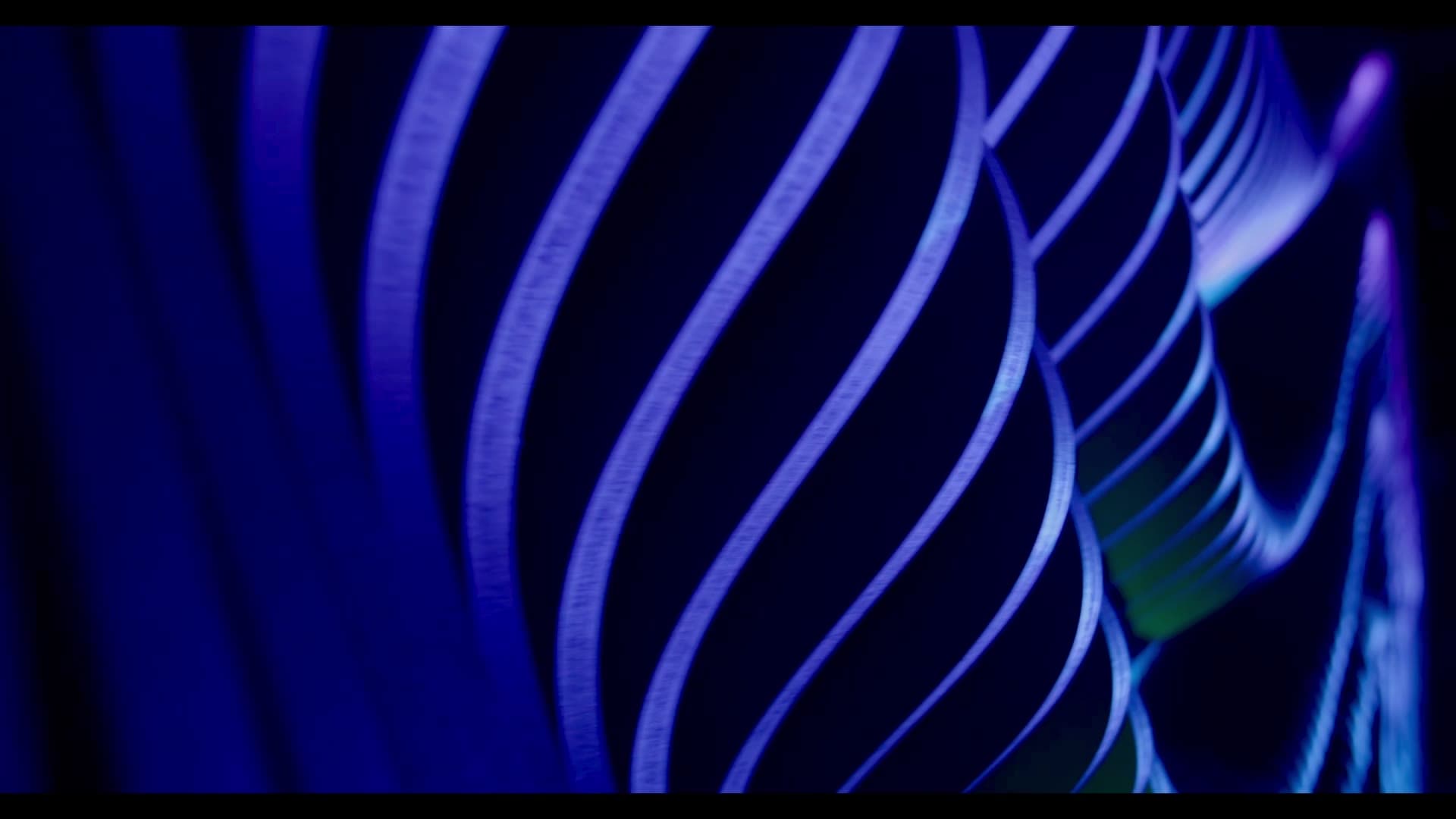 Parametric projection wall, flowing CNC-fabricated rib relief in motion